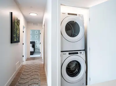 a laundry room with a washer and dryer at Mountain Revelation by Revelstoke Vacations in Revelstoke