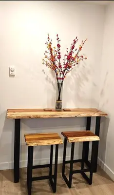 a wooden table with a vase with a plant on it at Brand new suite in langley close to everything in Langley