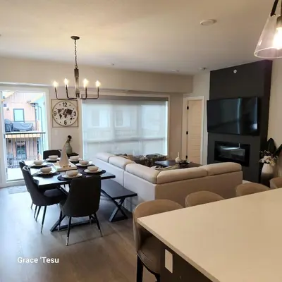 a living room with a couch and a table at Cozy Cove Retreat Escape to Tranquility Stay in Simplicity in Dead Man's Flats
