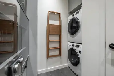 a laundry room with two washer and dryer at Blueberry Hill Estates 3144 by Outpost Whistler in Whistler