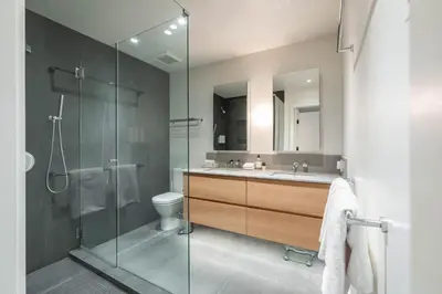 a bathroom with a shower and a toilet and a sink at Blueberry Hill Estates 3144 by Outpost Whistler in Whistler