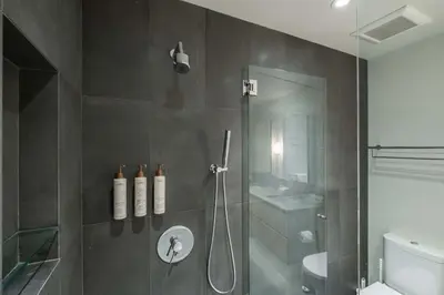 a bathroom with a shower with a glass door at Blueberry Hill Estates 3144 by Outpost Whistler in Whistler