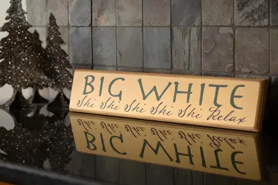 a sign that reads big white and a christmas tree at Dwight Out Chalet with Hot Tub in Big White