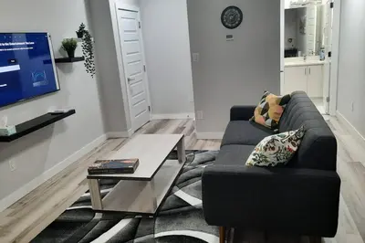 a living room with a couch and a coffee table at Carsonway Basement Suite in Edmonton