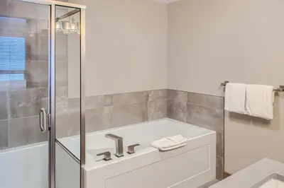a bathroom with a sink and a shower at Stonegate Resort Unit B105 in Big White