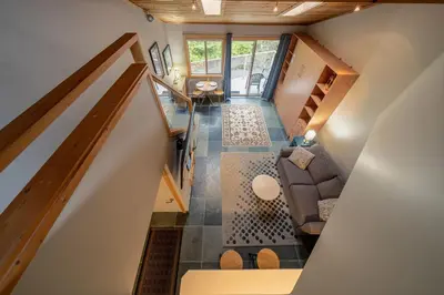 an overhead view of a living room from the loft at Shorewater Resort, Qualicum Beach in Qualicum Beach