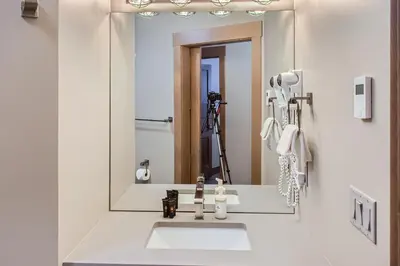 a bathroom with a sink and a mirror at Stonegate Resort Unit B103 in Big White