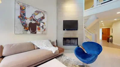 a living room with a couch and a fire place at TELEMARK 25 Ski-In Ski-Out Access Steps To Ski Lifts Renovated Townhome in Whistler