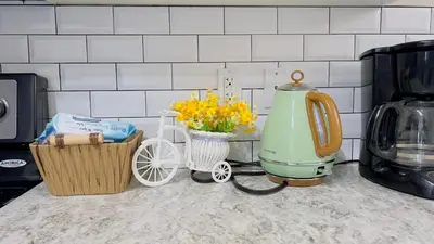 a kitchen counter with a mixer and flowers on it at Sylvan Lake Retreat I 122A Hinshaw Drive, Sylvan Lake in Sylvan Lake
