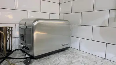 a toaster sitting on a wall in a kitchen at Sylvan Lake Retreat I 122A Hinshaw Drive, Sylvan Lake in Sylvan Lake