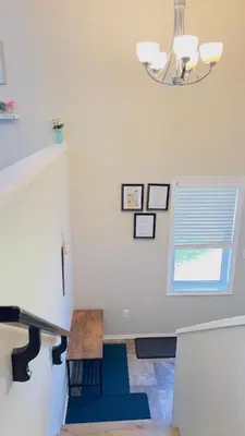 a living room with a table and a window at Sylvan Lake Retreat I 122A Hinshaw Drive, Sylvan Lake in Sylvan Lake