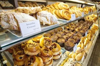 a bakery filled with lots of different types of pastries at Jungle House, AirCon, Sleeps 8, Near WEM & DT! in Edmonton