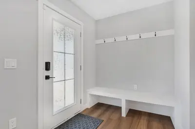 a white room with a white table and a window at Your stay at Haysboro in Calgary