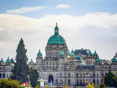 a large white building with a green dome at Coastal Charm - min 3-Day Stay Breathtaking Views with Work Desk by Victoria Prime! in Victoria