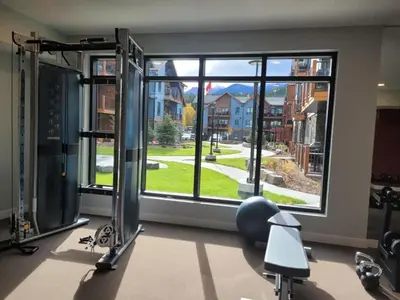 a room with a gym with a large window at Serenity at Sparrowhawk Lodge Brand New 2Bd 2Ba in Dead Man's Flats