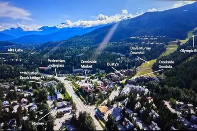 an aerial view of a town in the mountains at Powder & Pines Boutique Apartment in Whistler