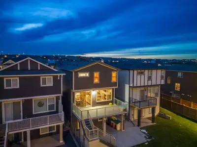an aerial view of a house at night at 3 Bedroom Sage House with AC, Driveway Parking, King Bed & More in Calgary