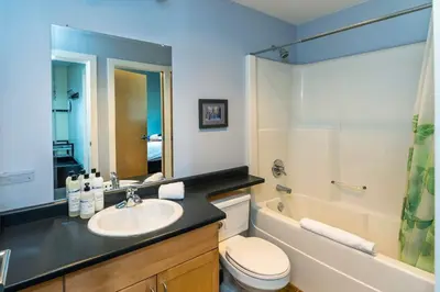 a bathroom with a sink and a toilet and a shower at NN - The Kit 4 - Downtown 1-Bed 1-Bath in Whitehorse