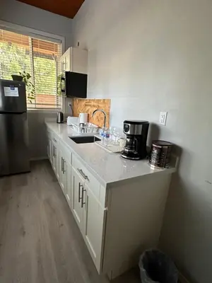 a kitchen with a sink and a counter top at \u8212\u9002\u5927\u5e8a\u5957\u623f in Richmond