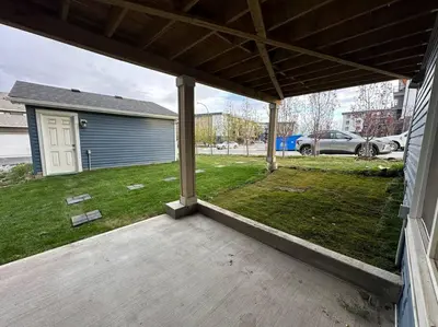 an empty porch of a house with a yard at The Urban Nest in Calgary