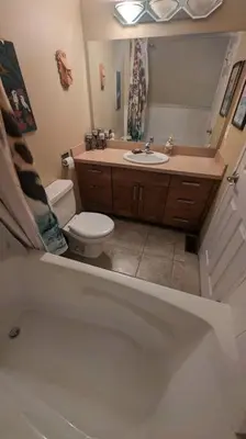 a bathroom with a toilet and a sink at Spacious West Kelowna Home that is great for family, friends, or business trip! in West Kelowna
