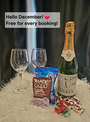 a bottle of champagne and a glass of wine at Spacious Private Cozy 2br Home with TeePee Dining Room! Private Parking! Self Check-in in Burnaby