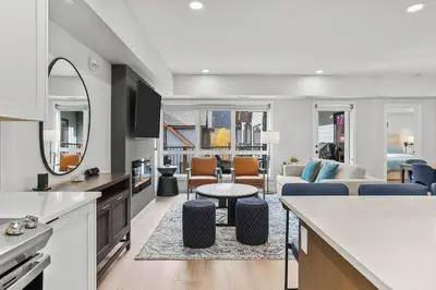 a kitchen and living room with a couch and a table at Perfect 3 bed-2 bath Top Floor Hot Tub Heated Pool Gym in Dead Man's Flats