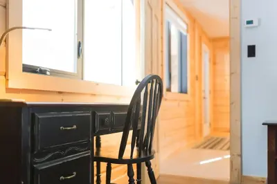 a black chair sitting at a desk in a room at Snow Pines by StayIn in Fernie