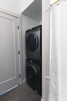 a black speaker in a room next to a door at The Brickworks at the 1896 Building in Kaslo