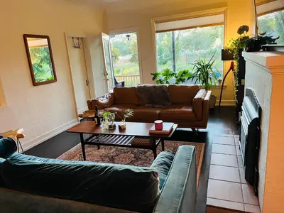a living room with a couch and a coffee table at Hikari-Okanagan Sunshine B&B in Kelowna