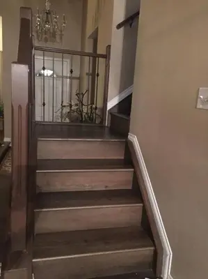 a set of stairs in a building with a chandelier at Renovated 4 bedrooms 20 sleeps Shopping Center in Edmonton