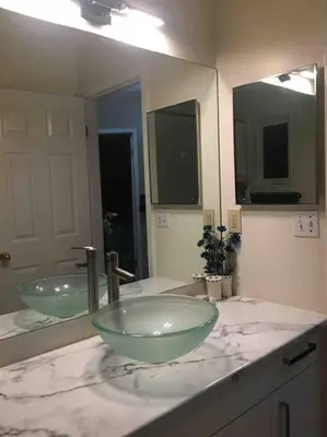 a bathroom with two glass bowls on a counter at Renovated 4 bedrooms 20 sleeps Shopping Center in Edmonton