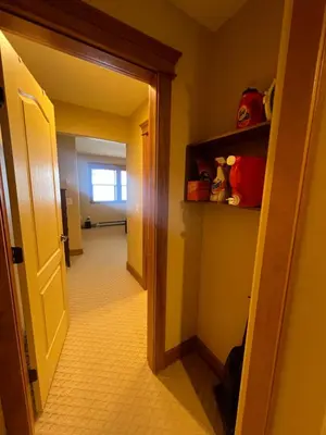a hallway with a door open to a room at Townhouse, Ski in Ski out in Big White
