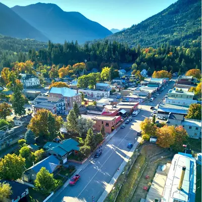 an aerial view of a small town in the mountains at The Crow's Nest at the 1896 Building in Kaslo