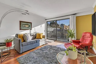 a living room with a couch and two chairs at Adorable 1-Bedroom Apartment on Kitsilano Beach in Vancouver