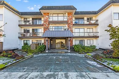 an empty driveway in front of a building at Adorable 1-Bedroom Apartment on Kitsilano Beach in Vancouver