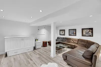 a living room with a couch and a table at Comfortable 2-Bed Suite Near UBC in Vancouver
