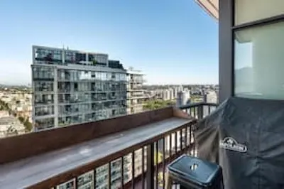 a balcony with a view of a building at The W, Modernized 2 bedroom Downtown Highrise in Vancouver