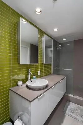 a bathroom with a sink and a mirror at The W, Modernized 2 bedroom Downtown Highrise in Vancouver