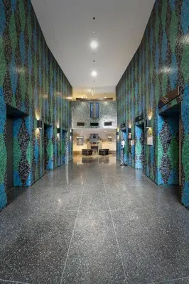 a large room with blue and green tiles on the walls at Central Downtown Highrise Condo in Vancouver