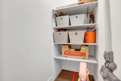 a shelf in a hallway with boxes on it at Modern Kitsilano 1 bedroom steps from the Beach in Vancouver
