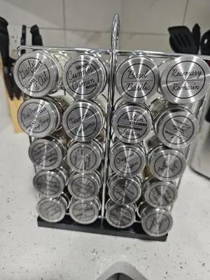 a bunch of silver muffins in a basket on a counter at Contemporary Two Bedroom Basement Suite in Edmonton