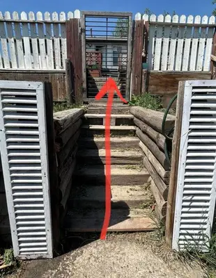 a red arrow on a set of stairs at Highland Park Upper Suite in Calgary