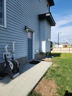 a house with a gym equipment next to a door at Luxury Cozy Basement Suite in Leduc