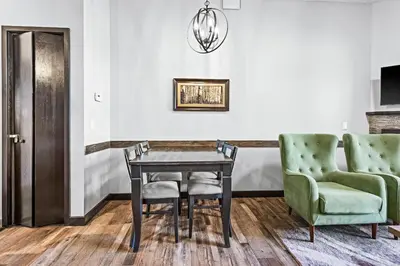 a dining room with a table and two chairs at Mountain Getaway in Canmore - Sleeps 6 - Pool & Hottub in Canmore