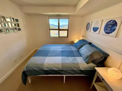 a bedroom with a large bed in a room at Lake View From Every Window! in Invermere