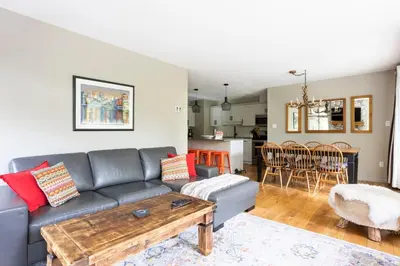 a living room with a couch and a table at Whistler Gleneagle 27 in Whistler