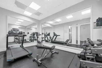 a gym with several treadmills and elliptical machines at Lovely 2-Bedrooms Downtown suite Free Parking in Vancouver
