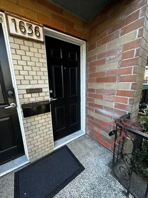 a door to a brick building with a number on it at Charming East Van Home Near DT and Commercial St in Vancouver