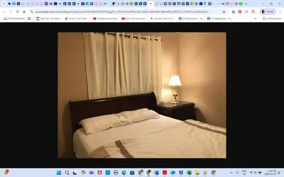 a bedroom with a bed and a window with a lamp at Main floor room 4, 22 minute from airport in Edmonton
